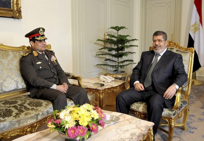 Egyptian Minister of Defense, Lt. Gen. Abdel-Fattah el-Sissi, left, meets with Egyptian President Mohammed Morsi at the presidential headquarters in Cairo, Egypt, Thursday, February 21, 2013.(AP Photo/Mohammed Abd El Moaty, Egyptian Presidency, File)